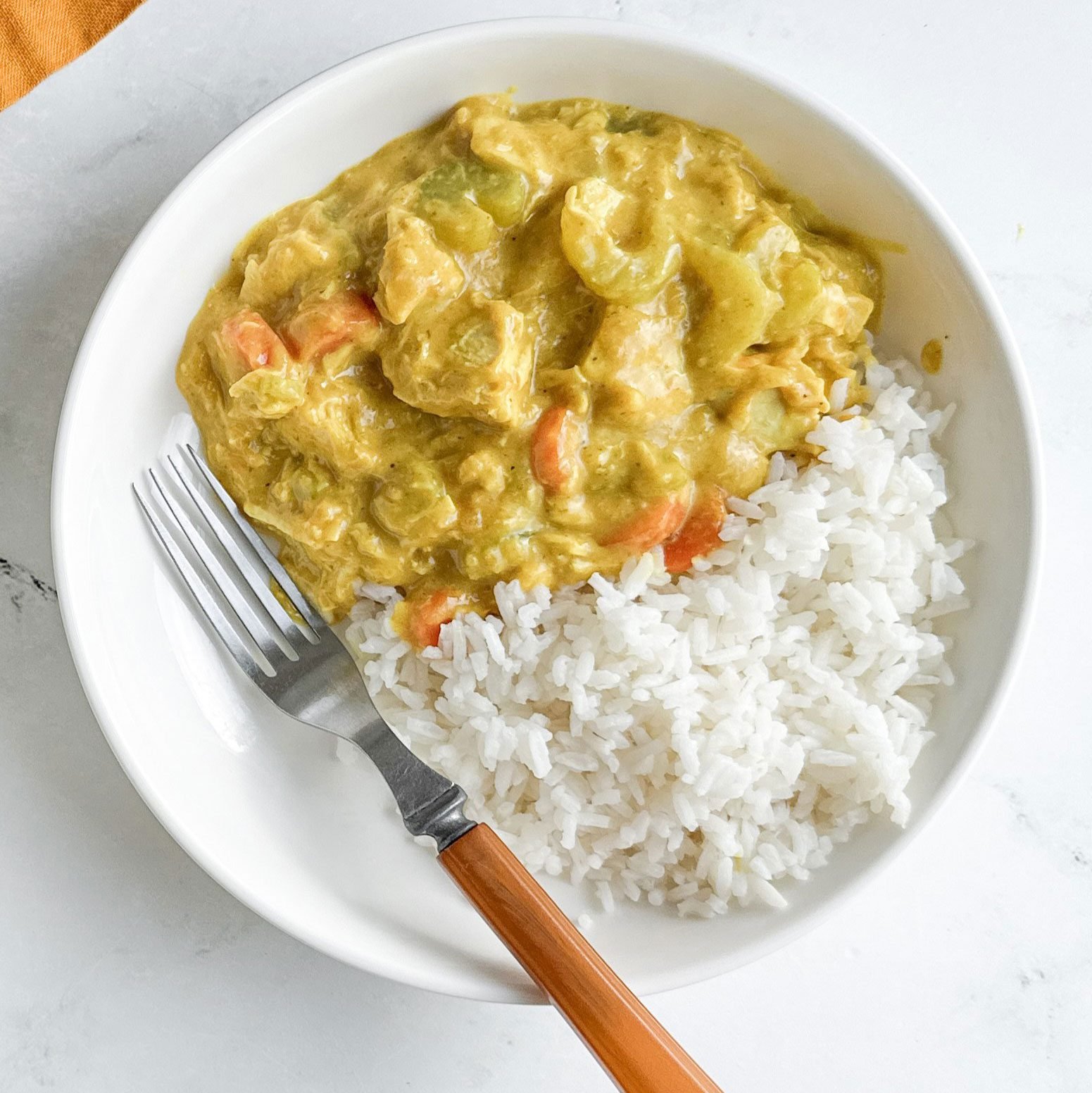 Taste of Home Turkey Curry in white bowls with rice
